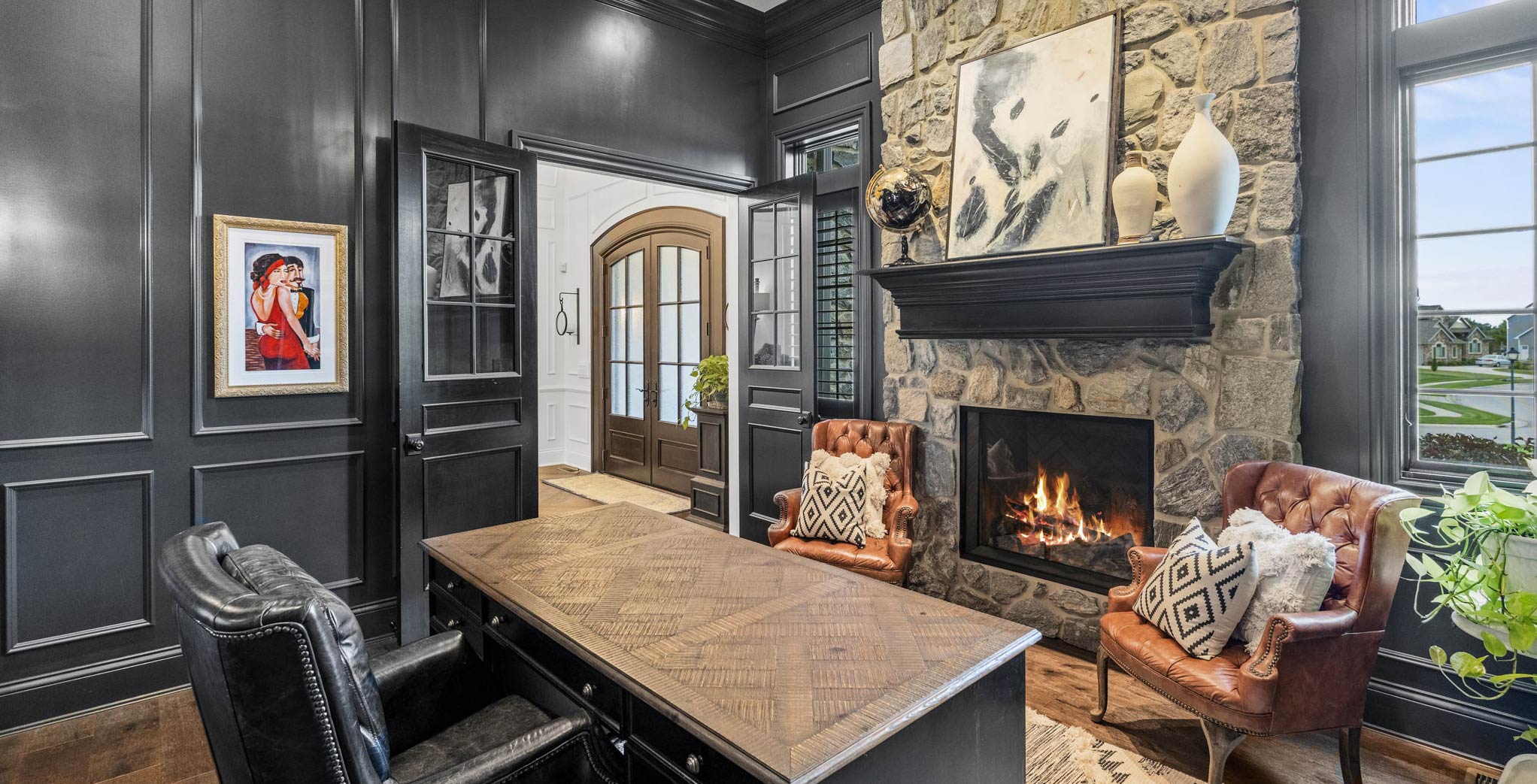 Office with desk and fireplace