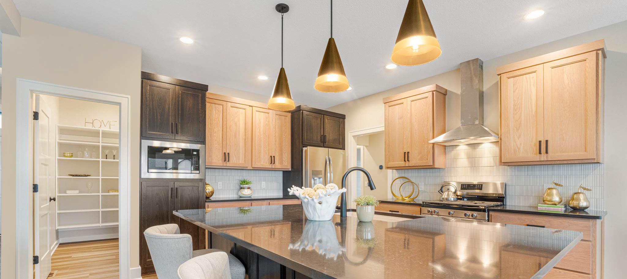 Kitchen with light brown flooring and dark & light cabinets
