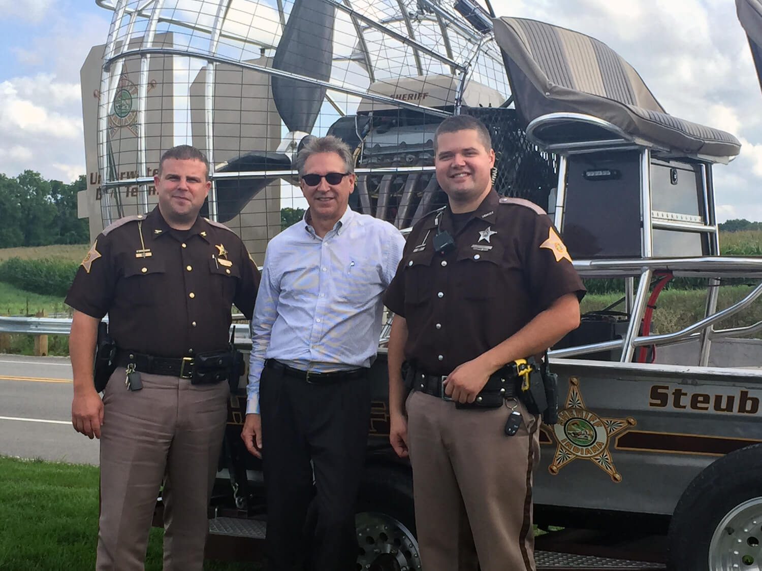 Chief Deputy RJ Robinson, Mark Bock and Officer Tony Tribble